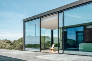 Frameless glass sliding panels by Arivo enclosing an outdoor pergola space, offering clear views and protection from the elements Frameless glass sliding panels by Arivo enclosing an outdoor pergola space, offering clear views and protection from the elements