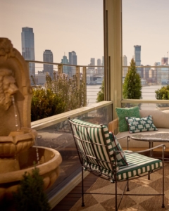 Elegant glass-enclosed terrace with city skyline view Elegant glass-enclosed terrace with city skyline view